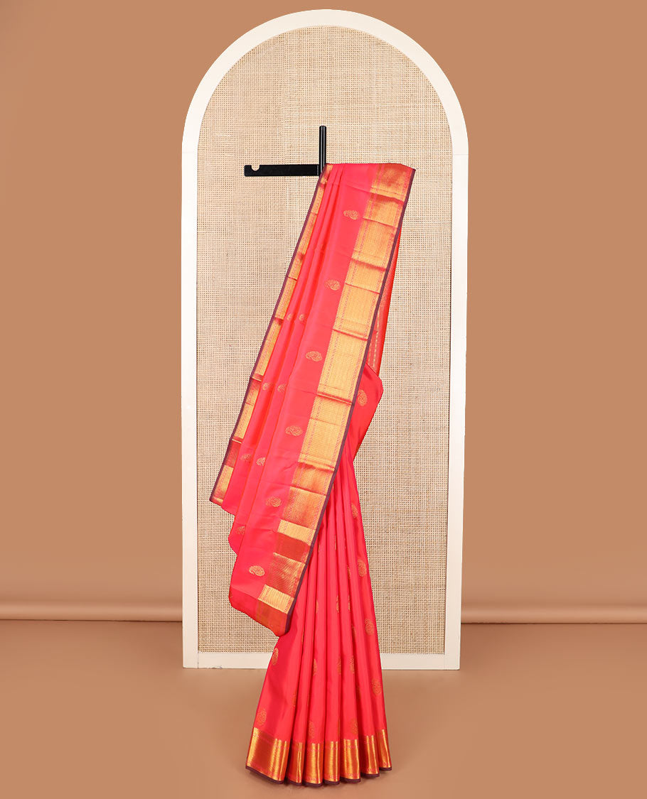 Red manga buttas Kanchipuram silk saree, zari border of thilakam mokku, zari stripes, and manga designs, and geometric patterned pallu