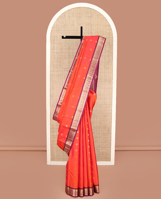 Orange Kanchipuram Silk Saree, Decked Up with Iruthalai Pakshi Buttas on Its Body, Complemented by a Contrast Border of Rekku, Muthu, and Kathir Designs, Grand Jaal Pallu, and Paired with a Contrast Blouse