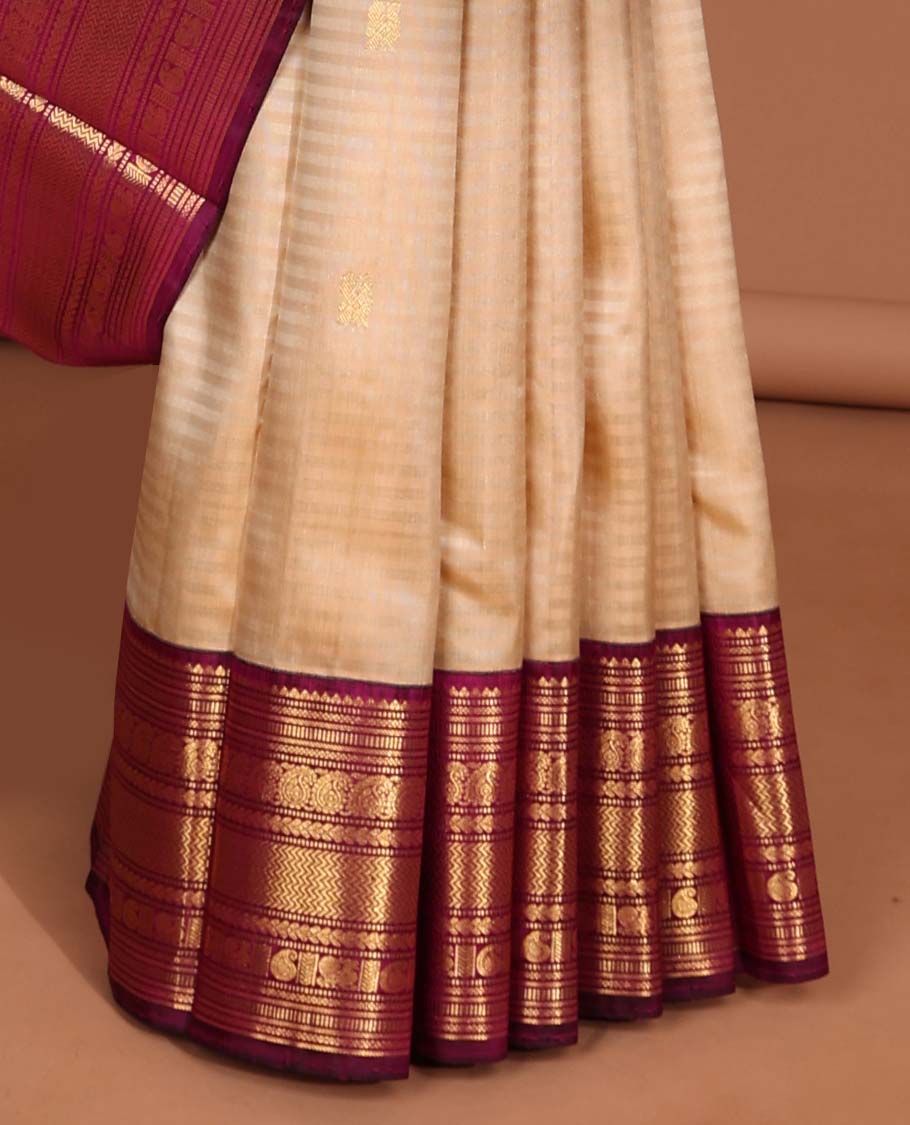 Cream striped kancheepuram silk saree with intricate zari pallu & korvai border of rekku,muthu,manga, vanki designs