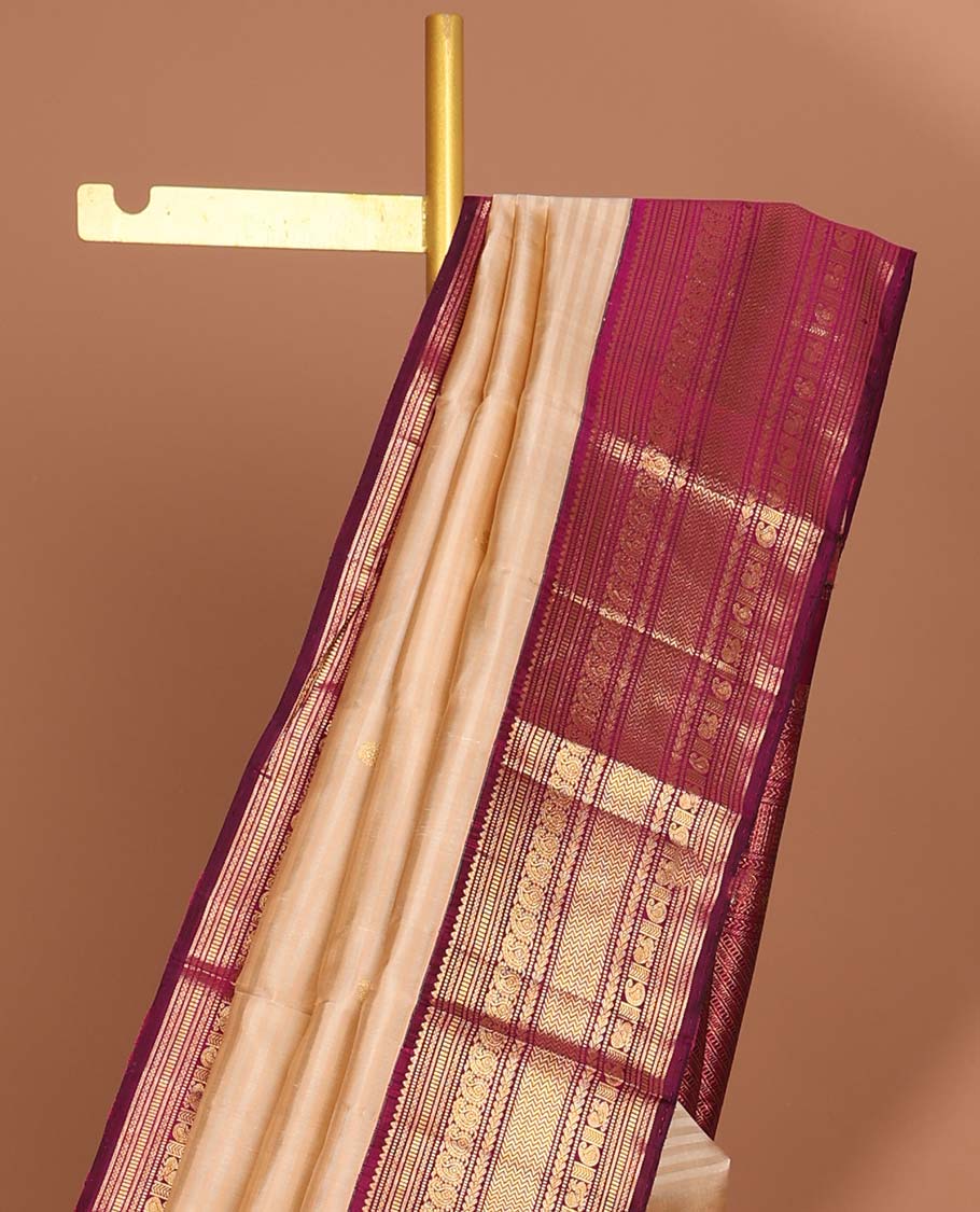 Cream striped kancheepuram silk saree with intricate zari pallu & korvai border of rekku,muthu,manga, vanki designs