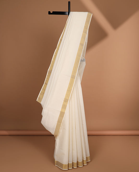 Cream plain design kerala saree, zari border & pallu of zari designs