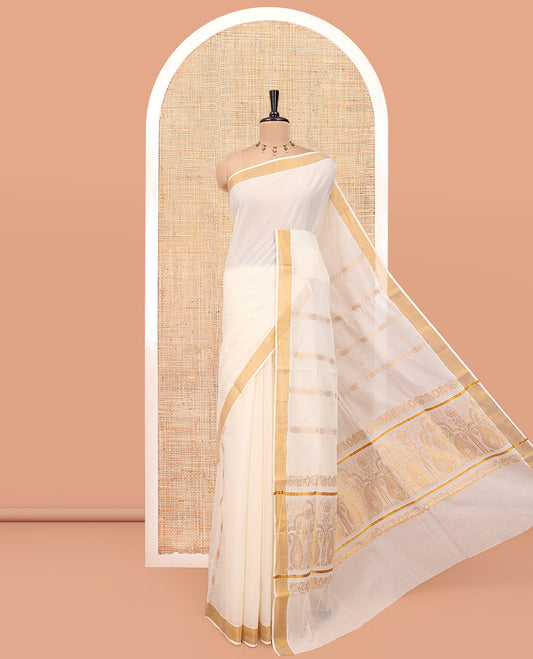 Cream Kerala Cotton Saree, Ornamented with Zari Stripes All Over Its Body, a Subtle Bavanji Border, Pallu of Paisley Designs, and Is Paired with a Matching Blouse