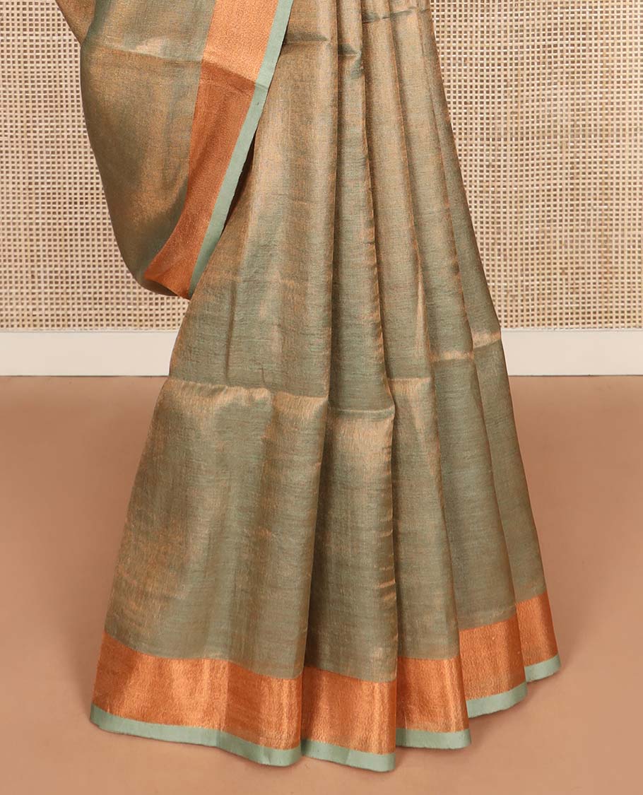 Green plain design linen cotton saree, bavanji zari border, and striped pallu