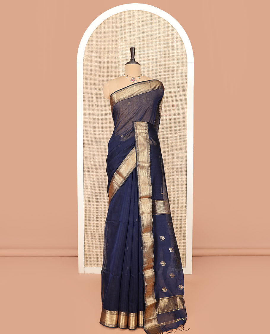Navy Blue Maheshwari Cotton Saree Prettified with Floral Buttas, Highlighted with a Traditional Zari Design Border, Pallu Adorned with Zari Stripes and Floral Buttas, and Paired with a Matching Blouse