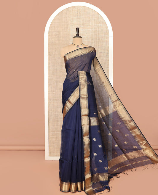 Navy Blue Maheshwari Cotton Saree Prettified with Floral Buttas, Highlighted with a Traditional Zari Design Border, Pallu Adorned with Zari Stripes and Floral Buttas, and Paired with a Matching Blouse