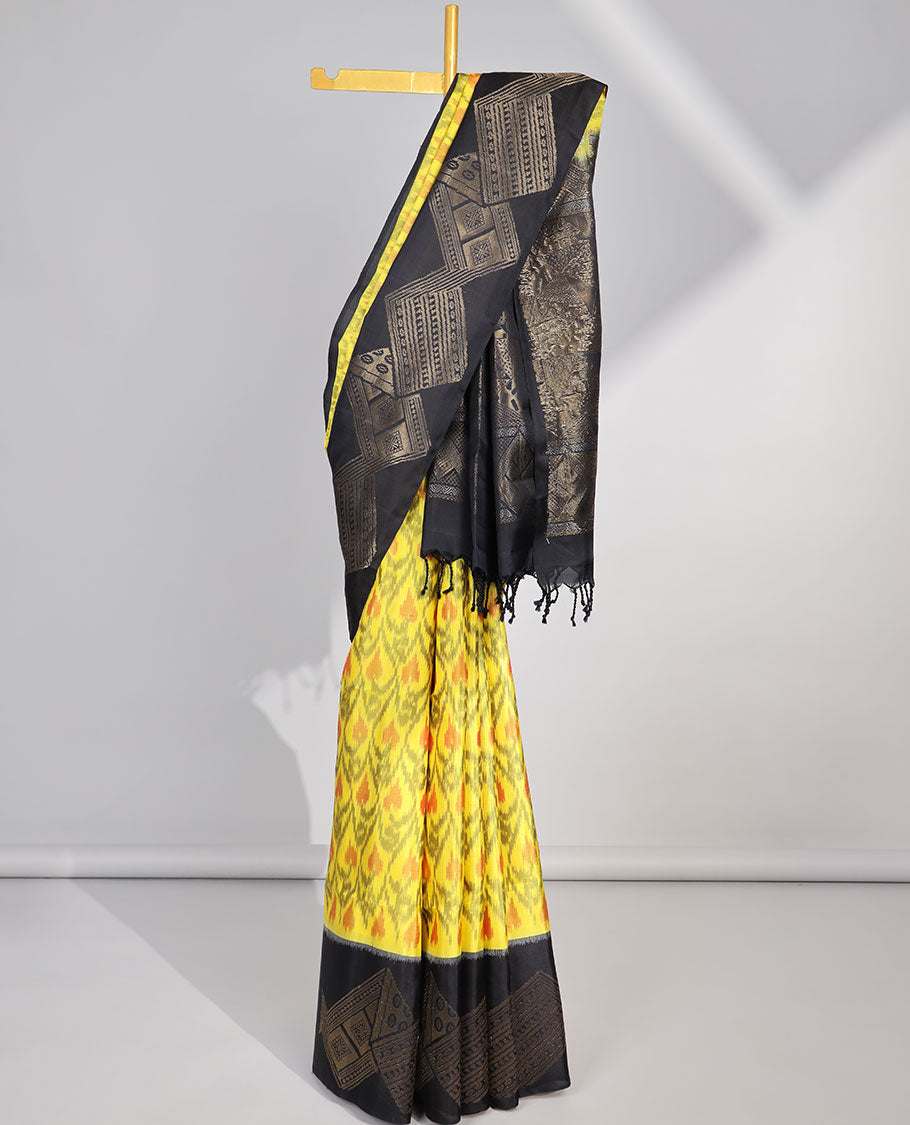 Yellow ikkat style floral vine design soft silk saree with contrast zari border & geometric zari design pallu