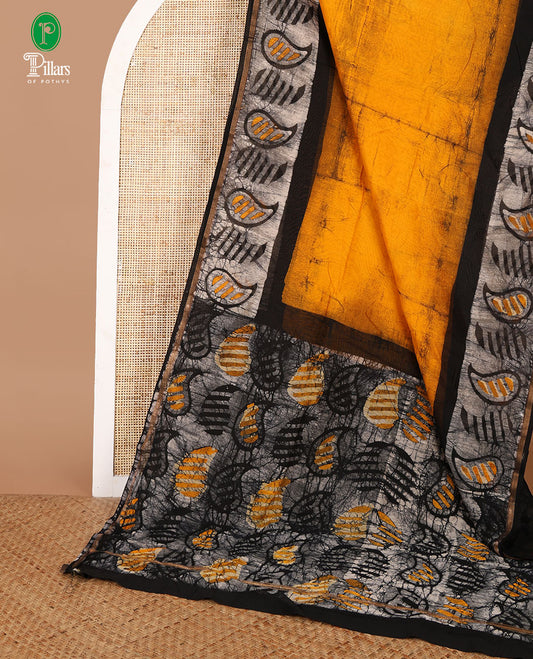 Mustard hand block batik printed chanderi cotton saree with black wax, checked border & black wax printed pallu along with plain blouse