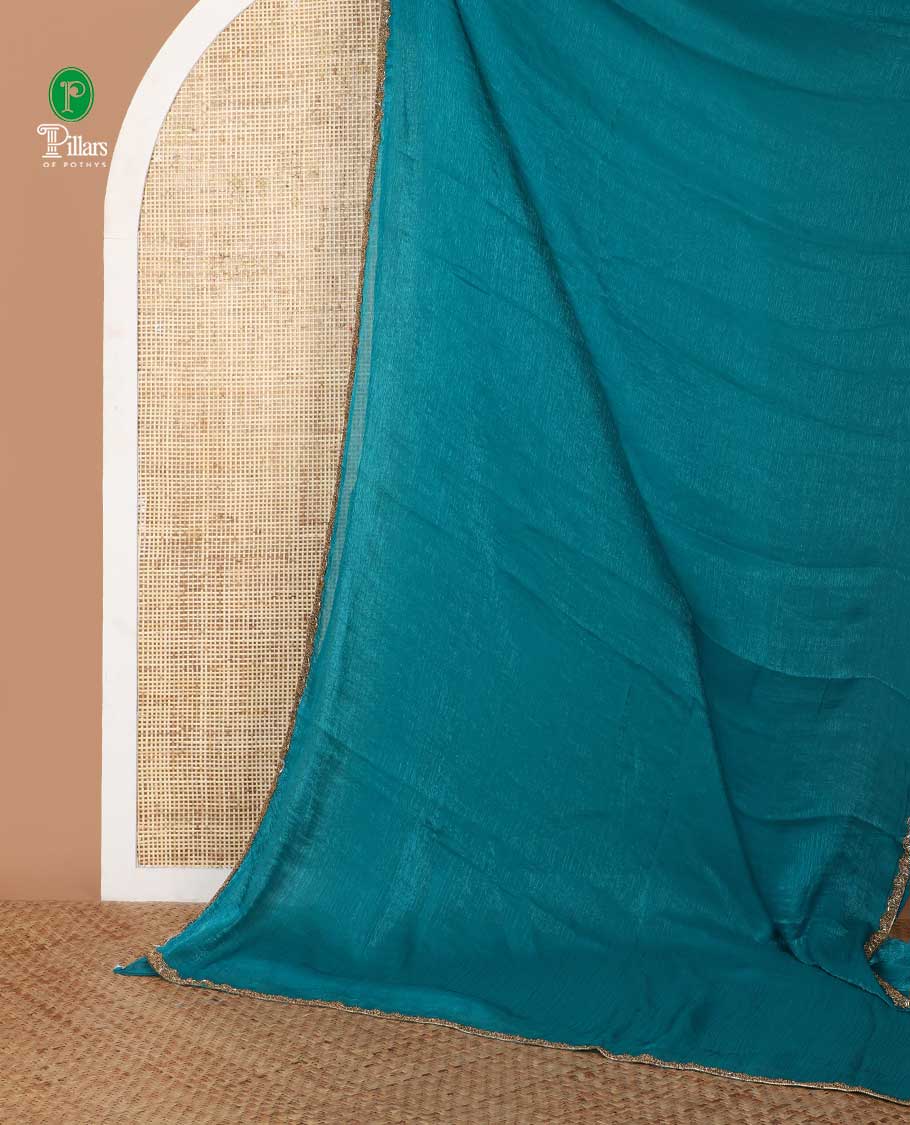 Rama blue fendy chiffon saree with hand work border & self pallu along with hand work blouse