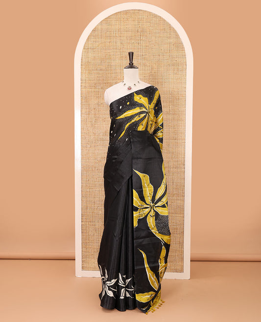 Black-base plain body khadi cotton saree with batik-style yellow-color radiant sunburst design on its border & pallu, plain black blouse