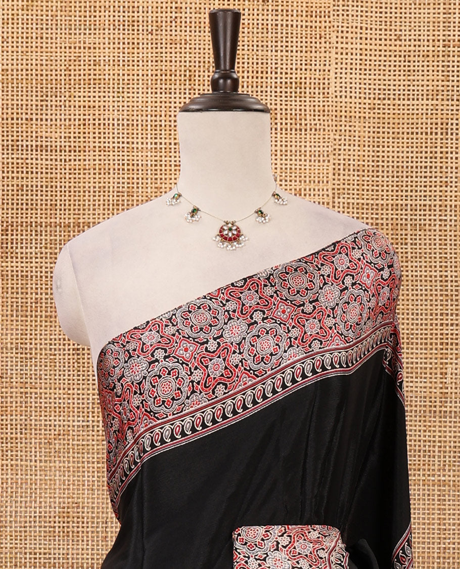Black plain design Turkey crepe saree, intricately Ajrakh-printed border, pallu & matching blouse
