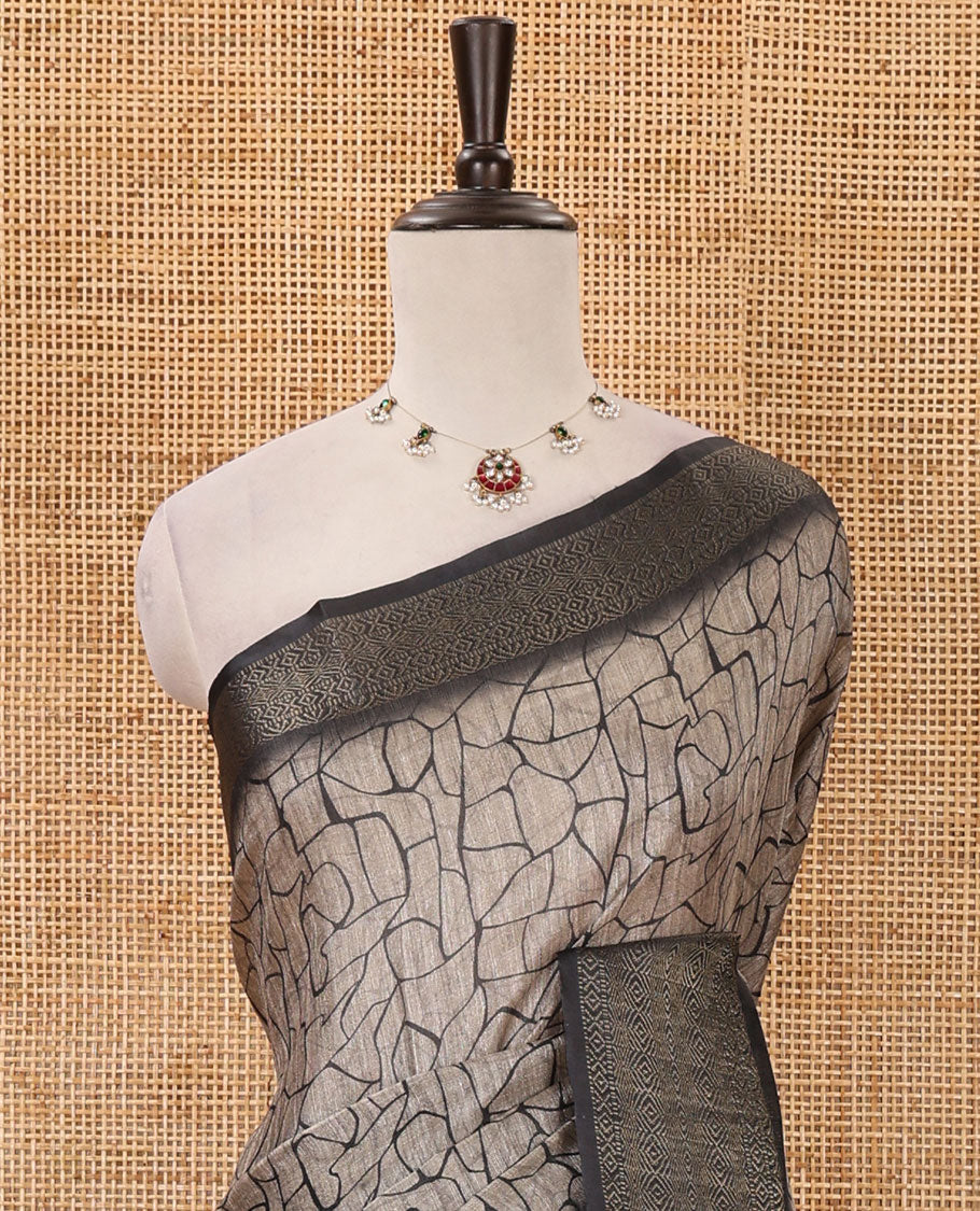 Chikku geometric printed semi-jute saree, contrast geometric zari border, pallu of madhubani elephant & bird print, & black blouse of print & zari work