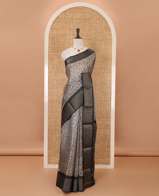 Chikku geometric printed semi-jute saree, contrast geometric zari border, pallu of madhubani elephant & bird print, & black blouse of print & zari work