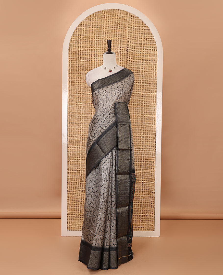 Chikku geometric printed semi-jute saree, contrast geometric zari border, pallu of madhubani elephant & bird print, & black blouse of print & zari work