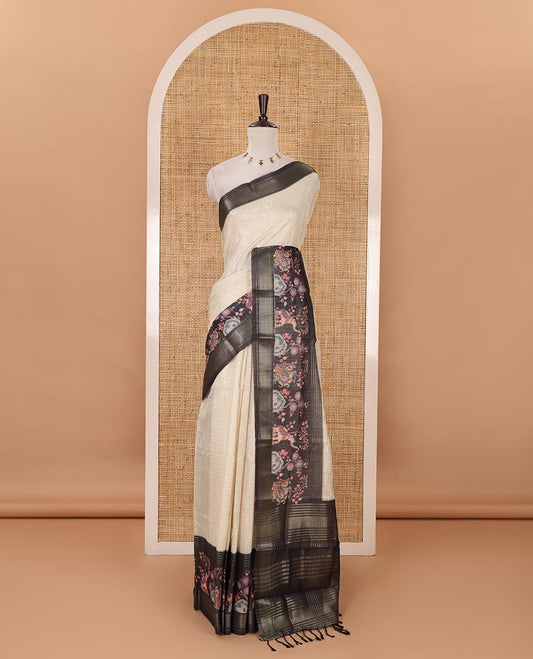 Cream zari checked tissue saree, contrast elephant & peacock printed zari border & pallu of zari stripes & contrast zari design blouse