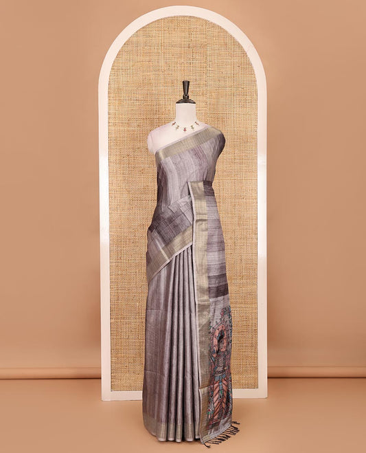 Black vertical stripes printed hand-brush dyed Katan silk saree, gold zari bavanji border, Madhubani-style human figurines printed pallu, and floral printed blouse