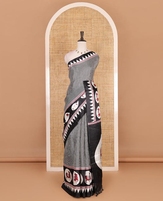 Cream-black vertically striped khadi cotton saree, contrast Pichwai cow printed temple border, Pichwai cow print pallu, and jaal printed blouse