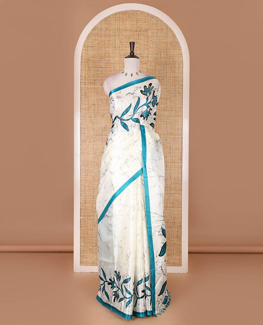 Half-white batik-style floral vine printed khadi cotton saree, contrast rama blue border, batik floral printed, and contrast flower motifs printed blouse