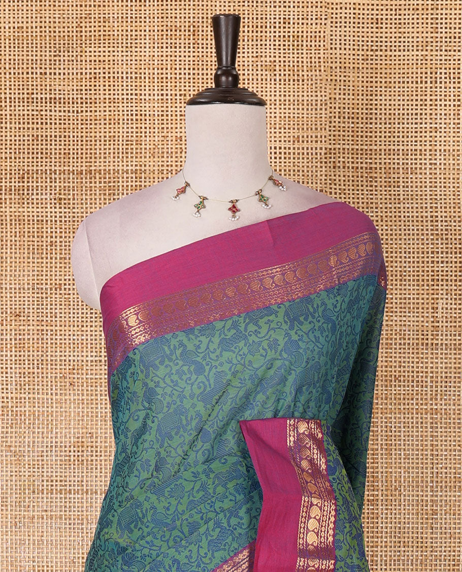 Green vanasingaram style flora-fauna motifs, Chettinad cotton saree, contrast traditional zari border, striped pallu, and contrast blouse