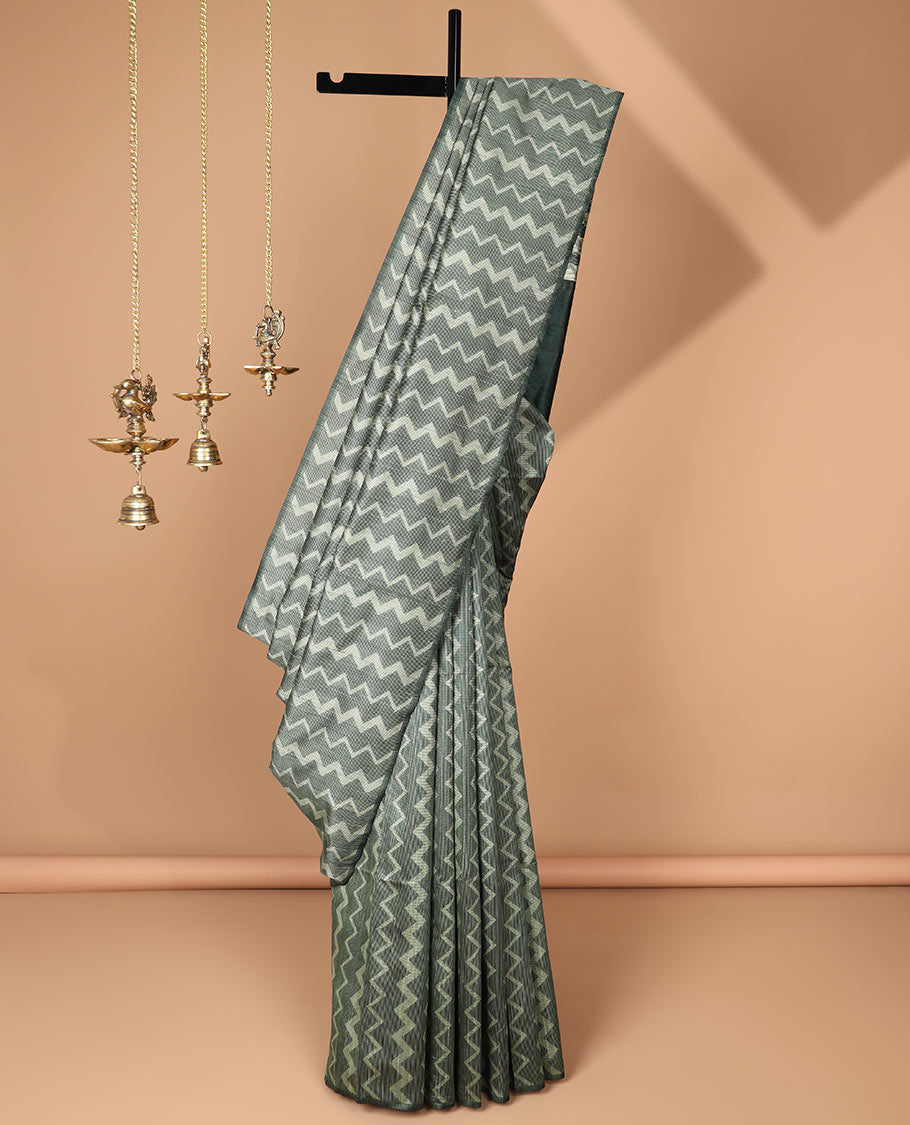 Borderless dark green kicha zig zad design semi jute saree with plain pallu & lining blouse