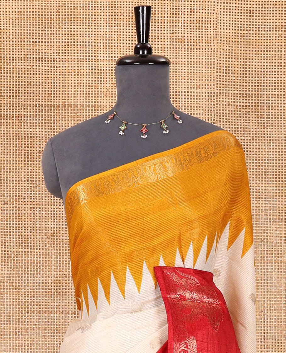 Half-white zari stripes and buttas dola silk saree, contrast red-orange Ganga-Jamuna temple elephant motifs border, paisleys printed pallu, and contrast elephant buttas blouse