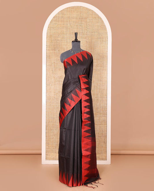Black sparsely striped semi-tussar saree, contrast temple red border, striped pallu, and contrast blouse