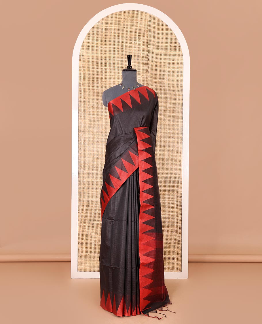Black sparsely striped semi-tussar saree, contrast temple red border, striped pallu, and contrast blouse