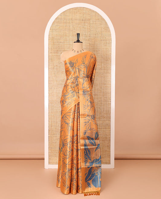 Borderless orange  big floral motifs printed tissue silk saree with floral printed pallu, and a contrast plain blouse