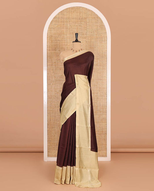 Brown embossed moss chiffon saree, contrast traditional rettai pettu border, embossed pallu, and a contrast embossed blouse