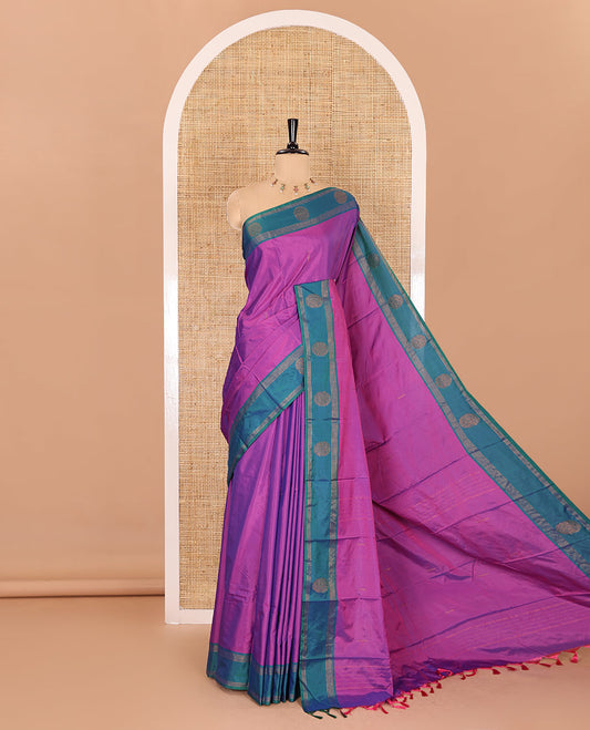 Magenta buttas semi-soft silk saree, contrast zari striped and round buttas border, striped pallu, and a matching blouse