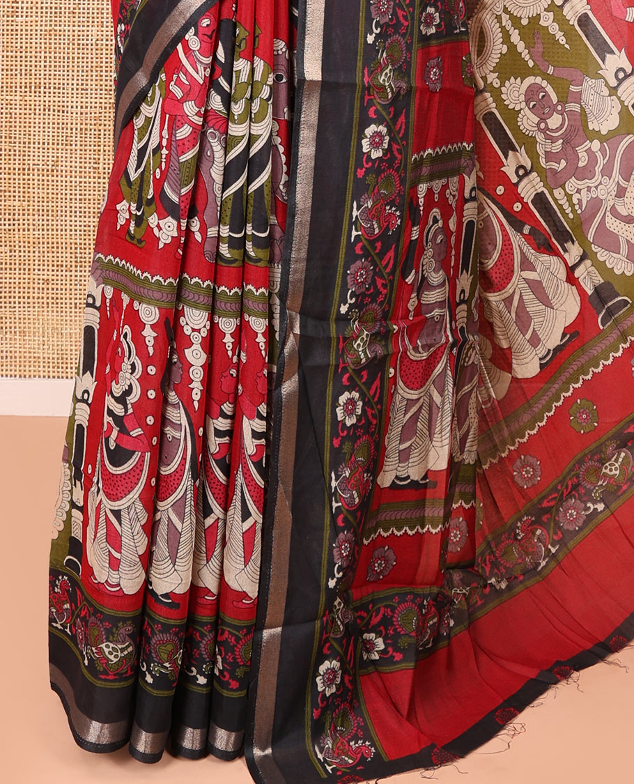 Red human figurines printed muslin cotton saree, contrast floral-peacock printed border of piping work, kalamkari printed pallu, and a contrast blouse of flower motifs print