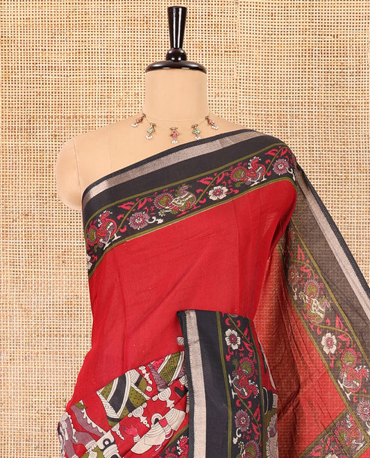 Red human figurines printed muslin cotton saree, contrast floral-peacock printed border of piping work, kalamkari printed pallu, and a contrast blouse of flower motifs print