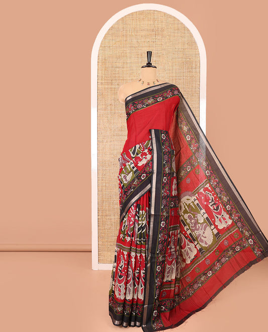 Red human figurines printed muslin cotton saree, contrast floral-peacock printed border of piping work, kalamkari printed pallu, and a contrast blouse of flower motifs print