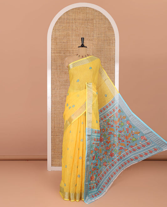 Yellow floral buttas printed linen cotton saree, zari border, contrast kalamkari floral vine printed pallu, and kalamkari floral vine printed blouse