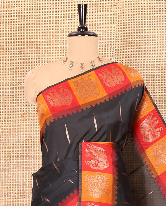 Black copper zari buttas woven kanchi silk saree, contrast temple border of peacock and elephant motifs, zari-rich pallu, and a zari design blouse