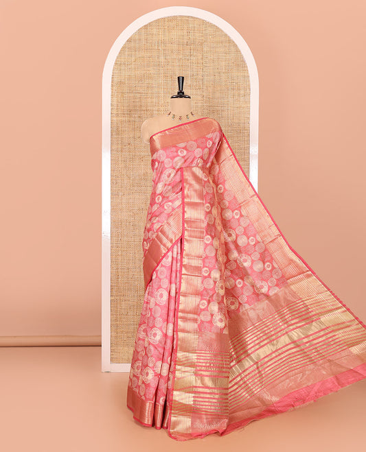 Pink lotus-leaf style printed semi-tussar saree, traditional zari border, zari striped pallu, and a matching blouse