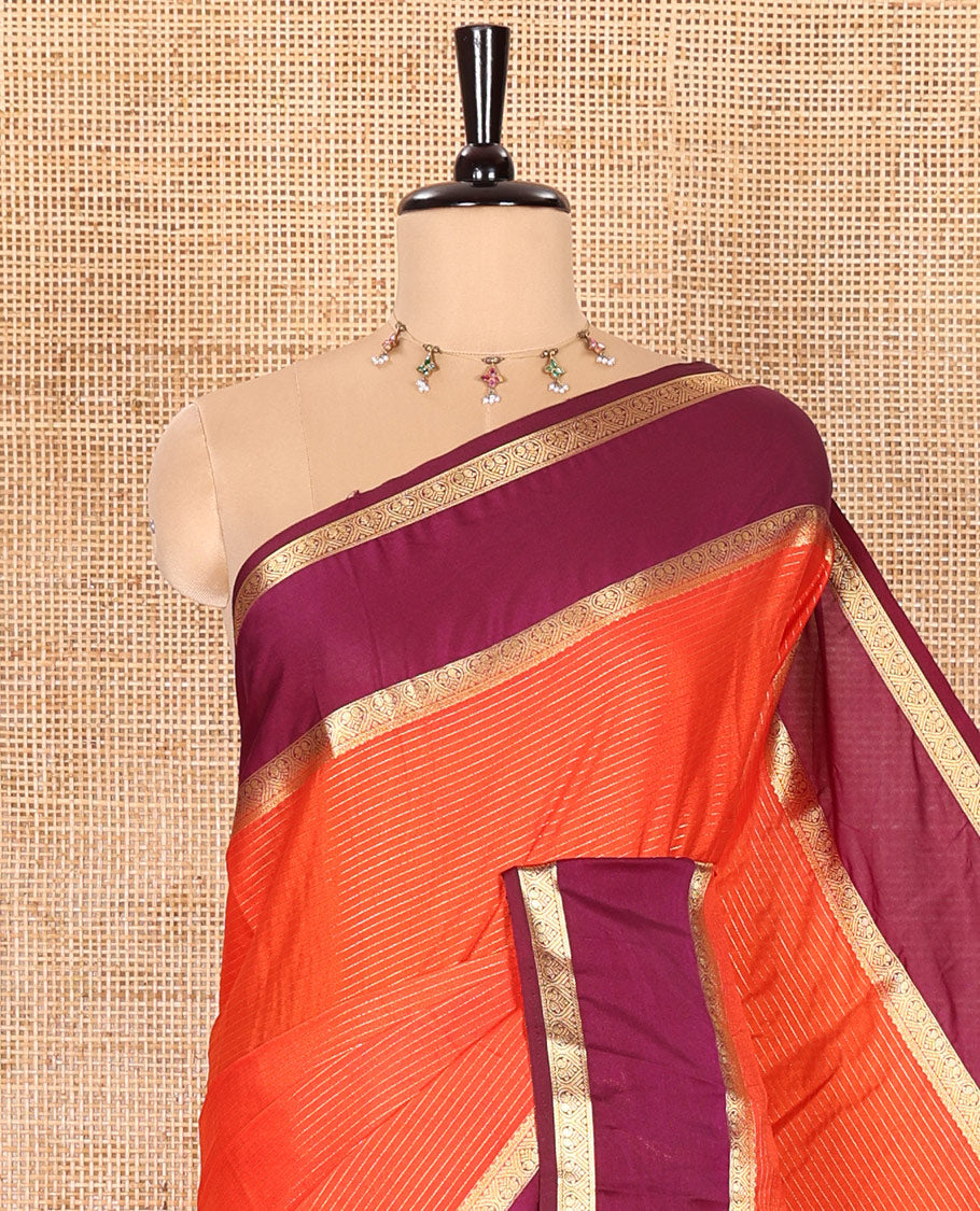 Rust Orange Art Crepe Saree Gleamed with Horizontal Zari Stripes Running Across the Body, Complemented with a Rettai Pettu Traditional Zari Border, Pallu of Zari Stripes, and a Contrast Zari Woven Blouse