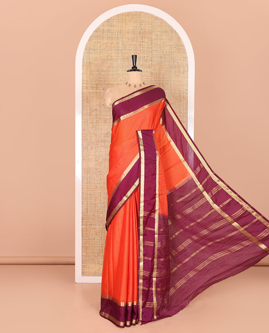 Rust Orange Art Crepe Saree Gleamed with Horizontal Zari Stripes Running Across the Body, Complemented with a Rettai Pettu Traditional Zari Border, Pallu of Zari Stripes, and a Contrast Zari Woven Blouse