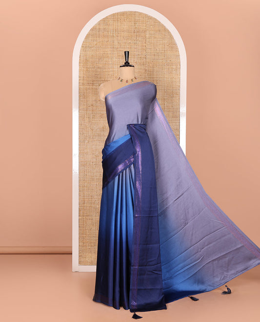 Blue Satin Crepe Saree Features 3D-Style Ombre Colours on Its Body, a Subtle Rose-Copper-Zari Woven Border, a Simple Plain Pallu, and a Plain Blouse