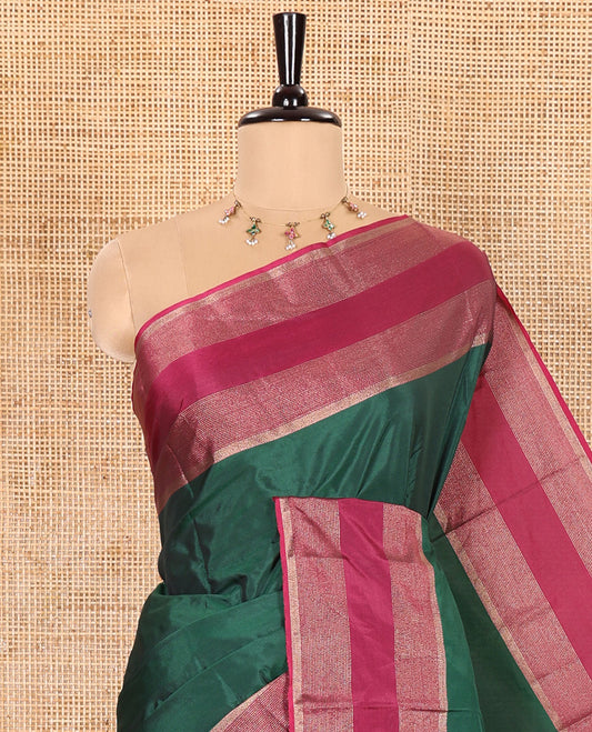 Green Plain Semi-Soft Silk Saree, Complemented by a Contrast Horizontally Zari Striped Border, Sparsely Striped Pallu, and a Matching Blouse