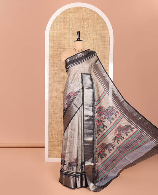 Grey and Black Dola Silk Saree Subtly Designed with Checks and Elephant Motifs Print, Complemented by a Contrast Traditional Zari Design Border, Pallu Depicting Elephant Motifs Print, and Paired with a Contrast Blouse