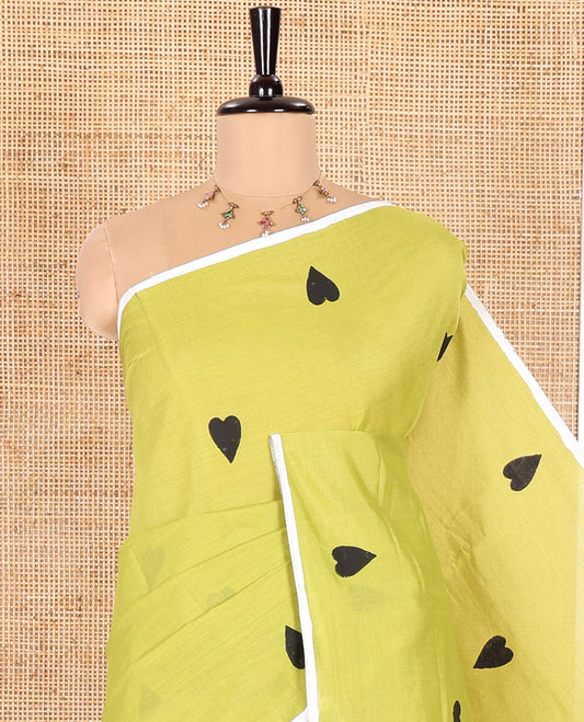 Borderless Parrot Green South Cotton Saree, Embellished with Heart Motifs Printed All Over Its Body, and Paired with One Matching Blouse, and One Contrast Floral Printed Blouse