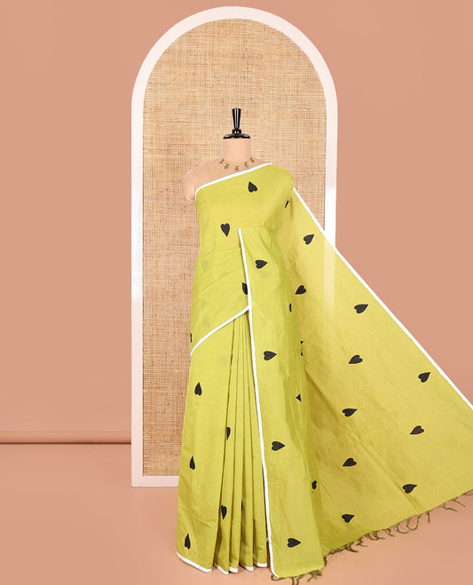 Borderless Parrot Green South Cotton Saree, Embellished with Heart Motifs Printed All Over Its Body, and Paired with One Matching Blouse, and One Contrast Floral Printed Blouse