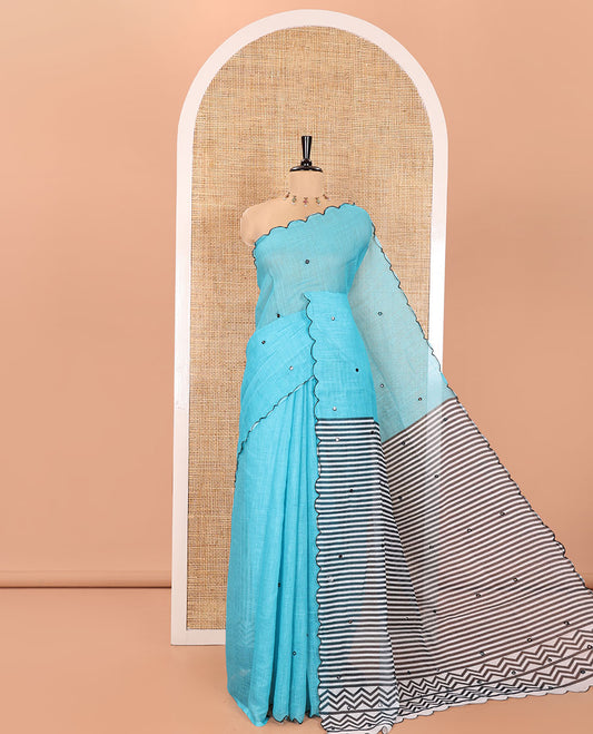Blue Linen Cotton Saree, Embellished with Mirror Work All Over Its Body, Subtly Scallop Border, Complemented by Contrast Pallu of Stripes and Mirror Work, and Paired with a Contrast Geometric Printed Blouse