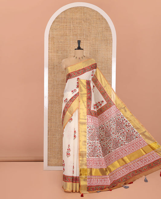 Cream Kerala Cotton Saree, Elevated with Floral Buttas Printed on Its Body, Highlighted by Gleaming Golden Zari Border, Pallu Features the Floral-Paisley Print, and Paired with a Matching Printed Blouse