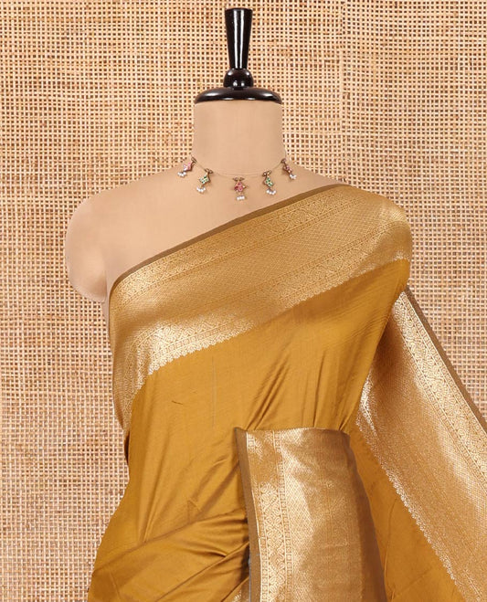 Mustard Plain Semi-Soft Silk Saree, Enriched with Traditional Zari Designs Woven Border, Grandly Woven Pallu Steeped with Chakram Designs, and Paired with a Matching Blouse
