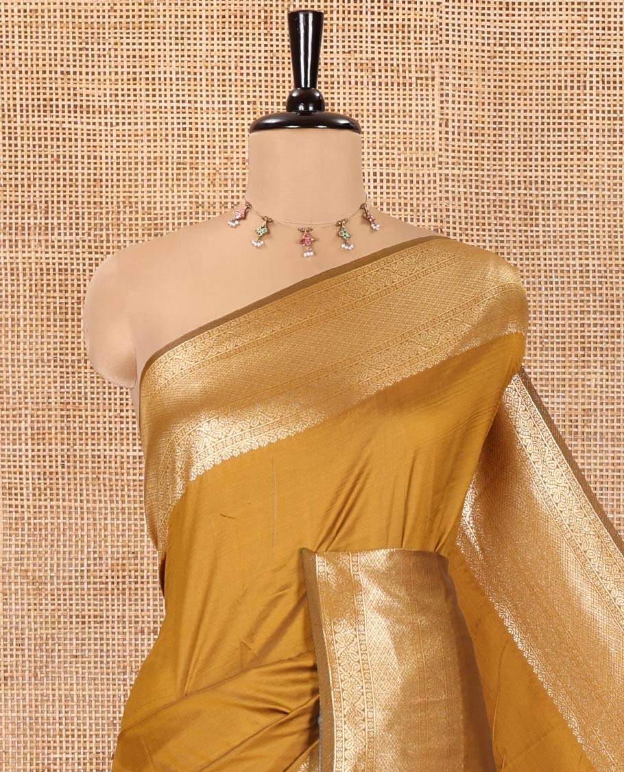 Mustard Plain Semi-Soft Silk Saree, Enriched with Traditional Zari Designs Woven Border, Grandly Woven Pallu Steeped with Chakram Designs, and Paired with a Matching Blouse