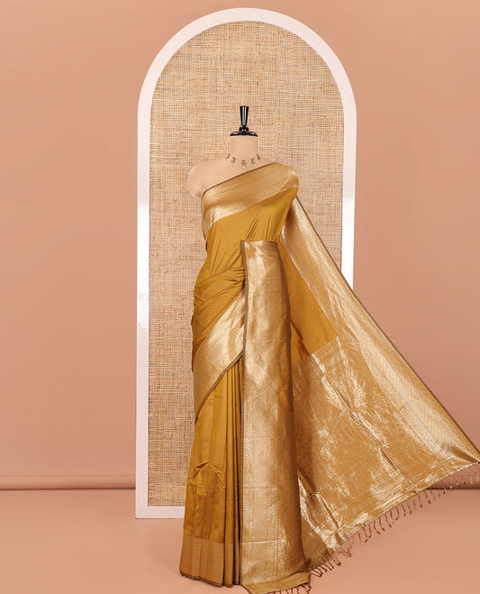 Mustard Plain Semi-Soft Silk Saree, Enriched with Traditional Zari Designs Woven Border, Grandly Woven Pallu Steeped with Chakram Designs, and Paired with a Matching Blouse