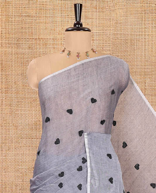 Borderless Grey Khadi Mul Cotton Saree, Artfully Designed with Heart Motifs Embroidery Across Its Body, Pallu mirrors the Same Design, and Paired with a Matching Blouse