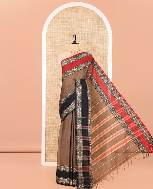 Chikku Plain Mercerised Cotton Saree, Complemented by a Contrast Ganga-Jamuna Rettai Pettu Thread Border of Temple, Elephant, and Chakram Designs, Subtly Striped Pallu, and Paired with a Matching Blouse