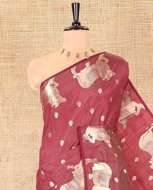 Brown Art Tussar Saree, Graced with Gold Zari Buttas All Over Its Body, Highlighted by a Zari Border of Pichwai Cow Motifs, Grandly Woven Pallu, and Paired with a Matching Blouse